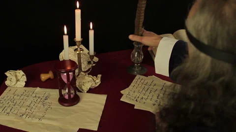 Chronicler writes in the candlelight Stock Footage 37186761