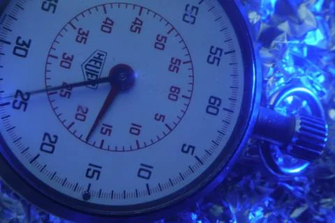 Chronometer with silver background and blue lighting Stock Photos