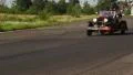 Chrysler 75 Roadster retro car on countryside road. HD Footage