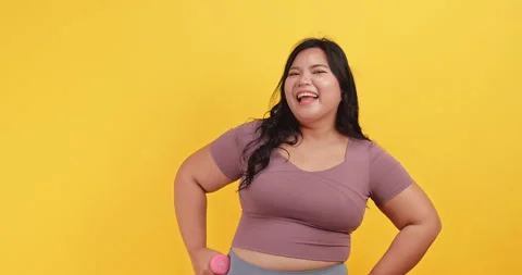 A chubby Asian woman in sportswear is sh... | Stock Video | Pond5