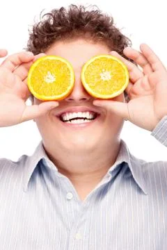 Chubby boy and orange Stock Photos