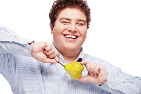 Chubby boy and pear Stock Photos