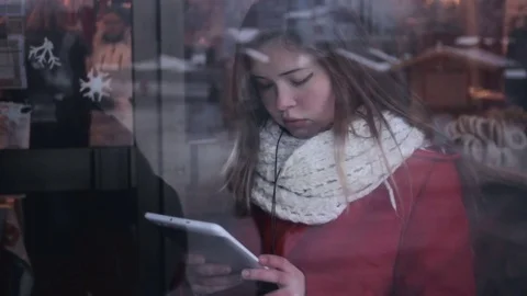 Chubby girl with tablet pc through the window Stock Footage 71897531