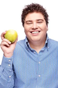 Chubby man holding apple Stock Photos