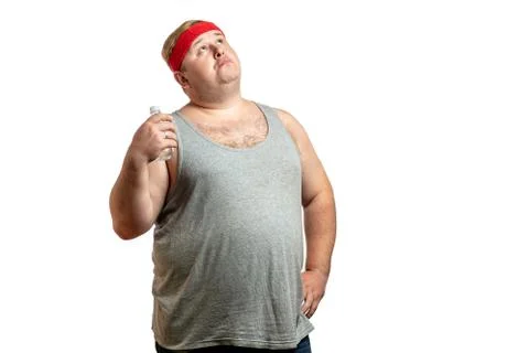 Chubby white man drinking fresh water after after hard exercises. Copyspace. Stock Photos