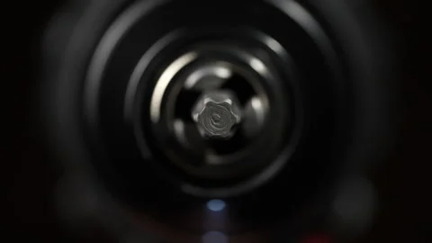 Chuck for cordless screwdriver with rotating torx bit on black background Stock Footage 307760448