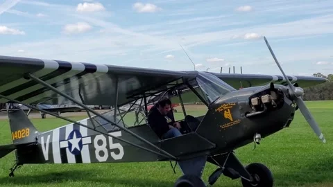 Chuck Tippet's L-4 Cub Cub/Champ rolls to a stop Stock Footage 141481525