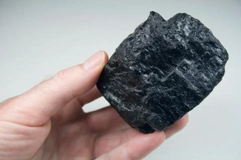 Chunk of Coal in Hand Stock Photos