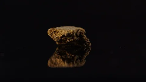 Chunk of hash on black with reflection-close-up Stock Footage 94349341