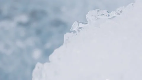 Chunk of Ice with a Stream in the Background Stock Footage 292941550