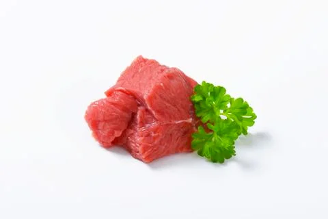 Chunk of raw beef steak on white background Stock Photos