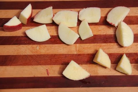 Chunks of apples on a cutting board Stock Photos