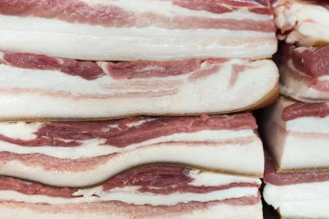 Chunks of bacon on each other Stock Photos