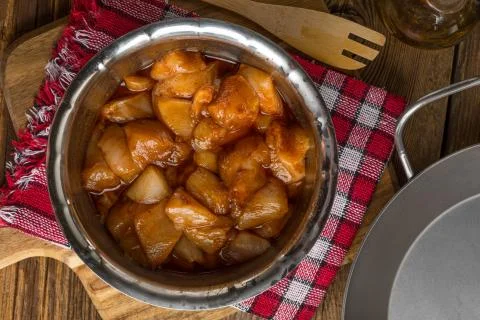 Chunks of chicken in marinade. Stock Photos