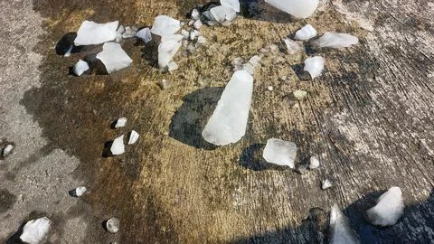 Chunks of crystal ice melt in hot weather. Stock Photos