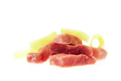 Chunks of fresh meat and pepper isolated on white Foto stock