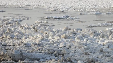 Chunks of ice flow down the river Stock Footage 7910341