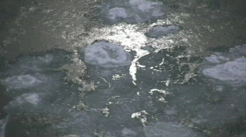 Chunks of ice gently flow down the river (High Definition) Stock Footage 64777