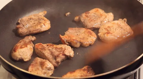 The chunks of meat fried in a pan with vegetable oil Stock Footage 63855222