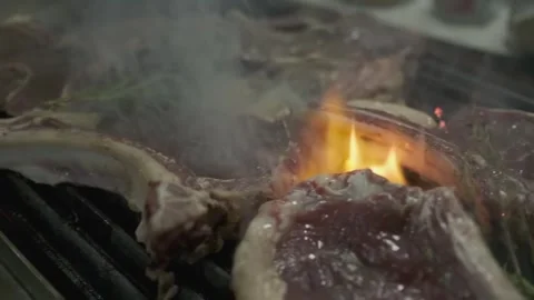 Chunks of meat steaks are grilled with fire Stock Footage 249377485