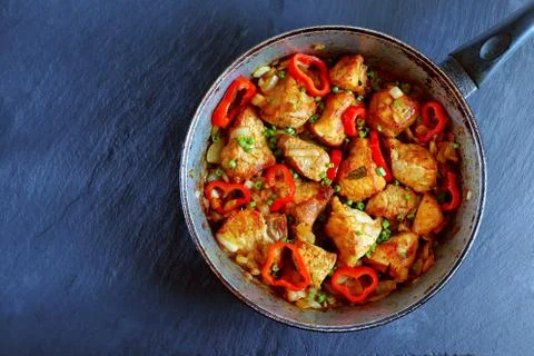 Chunks of  pork fried with onion Stock Photos