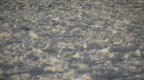 Chunks of snowy ice gently bob on water (High Definition) Stock-Footage 64402