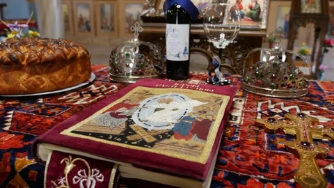 Church altar for wedding with book bread wine cross and crowns Vídeo Stock 240903773