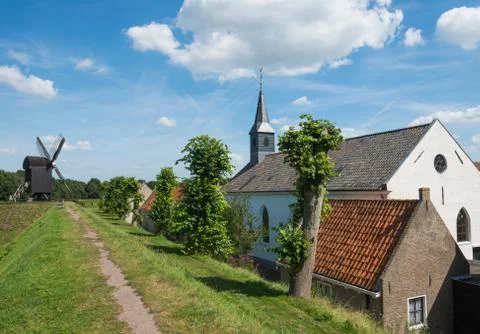 Church and windmill Stock Photos