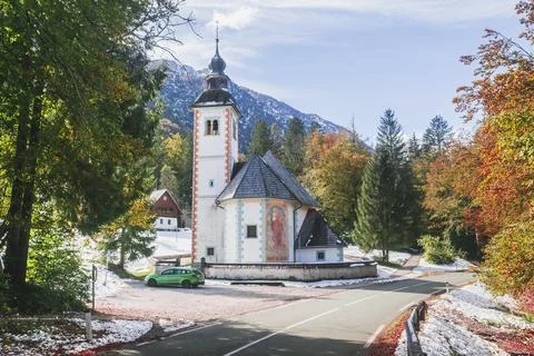 Church between the Alpine Range and Lake Bohinj in Slovenia Stock Photos
