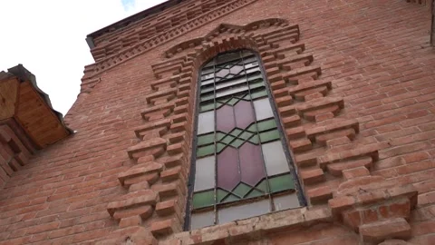 Church Building with red bricks and mosaic pattern window Stock Footage 248831006