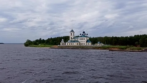A church by a calm lake. Video stock 341107243
