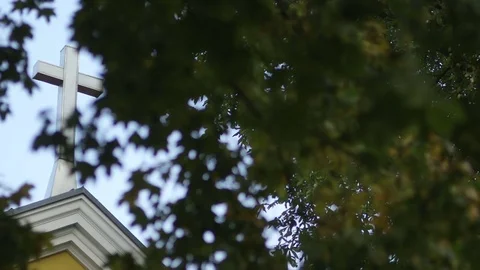 Church With Cross Seen Through Branches Stock Footage 73206342