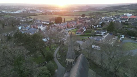 Church drone pull away at sunset with village in view, 4k Video stock 235093166
