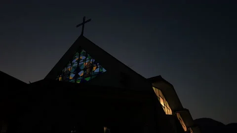 A church facade seen from below at sunset Stock Footage 220564972