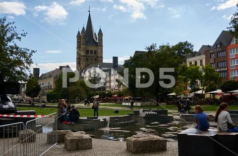 Church of Great St. Martin and other Cologne buildings seen from an outdoor p Stock Photos