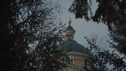 The Church is hidden behind the branches of a tree Stock Footage 130507404