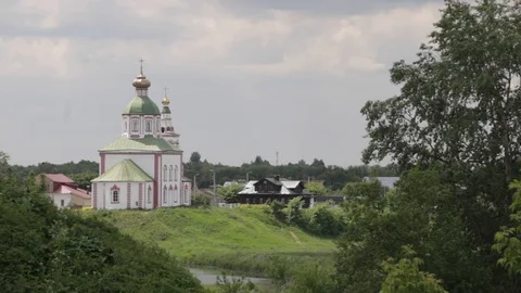 Church on the hill on a background of a cloudy sky and river. Ilyinskaya church Stock Footage 90785107