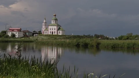 Church on the hill on a background of a cloudy sky and river. Ilyinskaya church Stock Footage 90909747