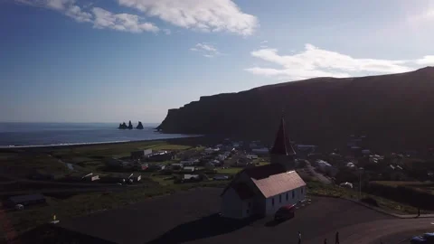 Church on hill in Iceland  aerial shot Stock Footage