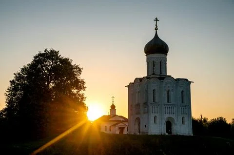 The Church of the Intercession of the Holy Virgin on the Nerl River at dawn Stock Photos