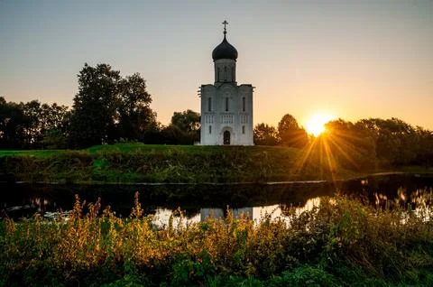 The Church of the Intercession of the Holy Virgin on the Nerl River at dawn Stock Photos