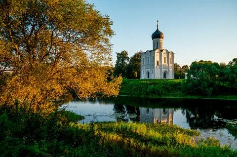 The Church of the Intercession of the Holy Virgin on the Nerl River at dawn Stock Photos