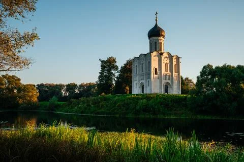 The Church of the Intercession of the Holy Virgin on the Nerl River at dawn Stock Photos