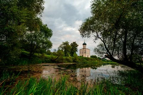The Church of the Intercession of the Holy Virgin on the Nerl River at dawn Stock Photos