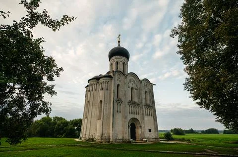 The Church of the Intercession of the Holy Virgin on the Nerl River at dawn Stock Photos
