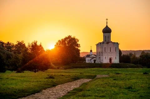 The Church of the Intercession of the Holy Virgin on the Nerl River at dawn Stock Photos