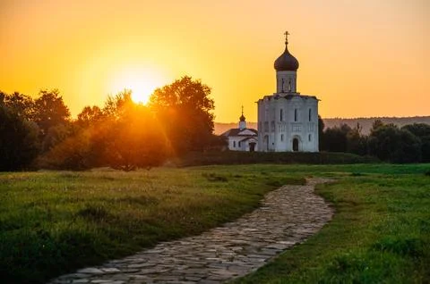 The Church of the Intercession of the Holy Virgin on the Nerl River at dawn Stock Photos