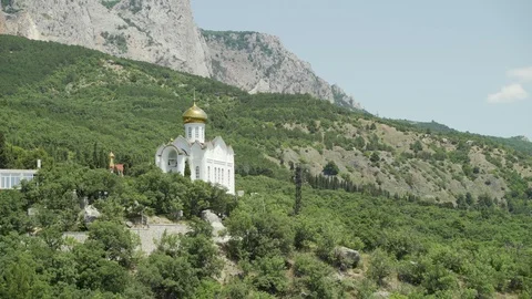 Church in the mountains on the background of rocks Stock Footage 115315351