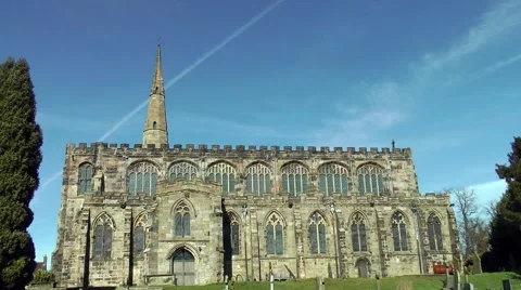Church old steeple tower moving tree blue sky vapor trail Stock Footage 47662143