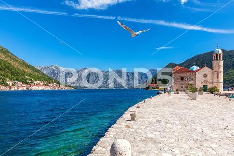 Church of Our Lady of the Rocks and view on Perast old town, Montenegro Stock Photos